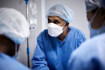 Image showing Surgery, surgeon or doctors with mask for emergency, accident or healthcare in hospital clinic. People, medical or nurses in surgical collaboration helping in operating room with teamwork or support