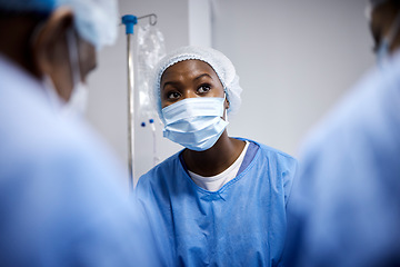 Image showing Surgery, teamwork or surgeons with mask for emergency, accident or healthcare in hospital clinic. Doctors, medical or African nurses in surgical collaboration helping in operating room with support