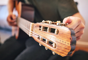 Image showing Hands, person and tuning guitar for music, talent and creative skill in sound production. Closeup, musician and singer check notes of acoustic instrument for audio performance, solo artist or concert