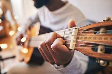 Image showing Closeup, hands of man and guitar for music, live talent and creative skill of sound production in home studio. Musician, singer or artist playing notes on acoustic instrument in solo jazz performance