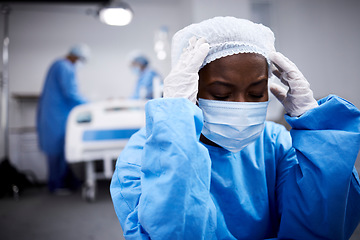 Image showing Black woman, stress or sad surgeon in surgery grieving after loss, operation failure or bad news in hospital. Depression, mask or upset doctor thinking with anxiety thinking of operating room mistake