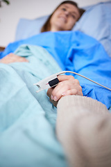 Image showing Holding hands, support and woman in hospital for cancer, sick or surgery. Comfort, care and person together with patient for hope, empathy or kindness, health and faith to help with medical healing.