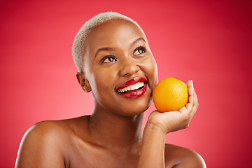 Image showing Orange, thinking and black woman with skincare, cosmetics and vitamin c on a red studio background. Female person, ideas and model with citrus fruit, makeup and wellness with natural beauty and detox