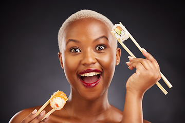 Image showing Woman, portrait and sushi surprise with chopsticks in studio for healthy eating, beauty and food. Face of a happy black person with makeup on a dark background for diet, wow or seafood advertising