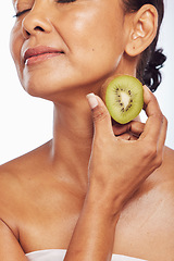 Image showing Skincare, beauty and senior woman with kiwi in studio isolated on a transparent png background. Food, fruit and natural model with nutrition for wellness, healthy diet and vitamin c for anti aging.