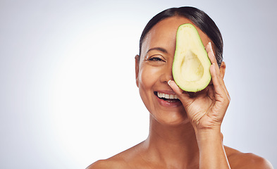 Image showing Skincare, face and mature woman with avocado in studio isolated on a white background mockup. Happy, natural fruit and portrait of senior model with nutrition, healthy diet and omega 3 for anti aging