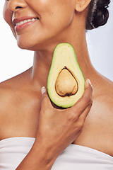 Image showing Avocado, skincare or happy woman with fruit for natural cleaning, detox or healthy skin with beauty. Wellness, hand or closeup of model smiling in dermatology treatment in studio or white background