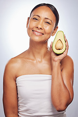 Image showing Skincare, portrait and senior woman with avocado in studio isolated on a white background. Face, natural fruit and happy model with food for organic nutrition, healthy diet and omega 3 for anti aging