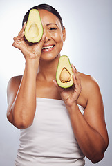 Image showing Senior, health and portrait of woman with avocado for skincare, nutrition or diet. Happy, face and elderly model or lady with food for wellness, beauty and detox isolated on a studio background