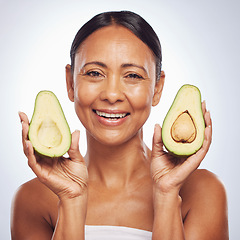 Image showing Avocado, portrait and beauty of woman in studio, white background and face glow. Happy mature model, natural skincare and fruits for sustainable cosmetics, vegan dermatology and facial benefits