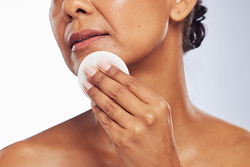 Image showing Skincare, closeup or woman with cotton pad for dermatology, wellness or healthy facial skin. White background, hand or face of person cleaning with swab for beauty shine, cleansing or dirt removal