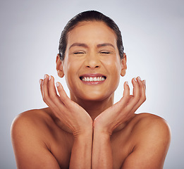 Image showing Happy, skincare and woman with hands for beauty, glow or wellness from dermatology. Smile, facial and excited model or person with anti aging treatment for cosmetics isolated on a studio background