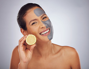 Image showing Woman, skincare, with lemon and face mask with charcoal, clay or natural beauty product for wellness, detox or nutrition. Fruit, vitamin c and girl with healthy cosmetics or vegan facial care