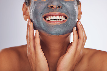 Image showing Woman, smile and charcoal mask on face for beauty, aesthetic dermatology or self care on white background in studio. Closeup of happy female model with clay skincare product, facial cosmetics or glow