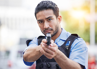 Image showing Gun, police man or security guard for protection service, safety and patrol officer in city. Law enforcement, professional supervision and face of asian crime worker in uniform outdoor with weapon