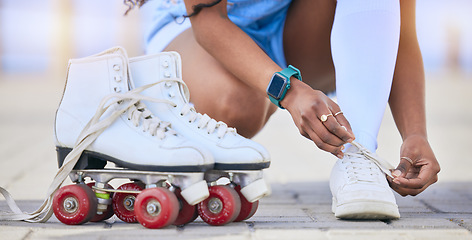 Image showing Hands, roller skates and tie shoes on street to start exercise, workout or training outdoor. Skating, person and tying sneakers to get ready for sports on road to travel, journey and fitness practice