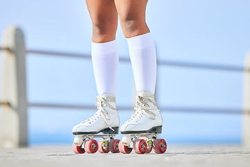 Image showing Legs, roller skates and shoes on street for exercise, workout or training outdoor. Skating, feet of person and sports on road to travel, journey and moving for freedom, hobby and fitness practice.