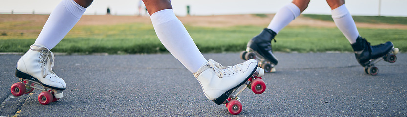 Image showing Legs, roller skates and shoes of friends on street for exercise, workout or training outdoor. Skating, feet of people and sports on road to travel, journey and moving for freedom, hobby and fitness