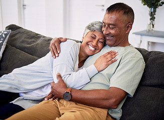 Image showing Hug, marriage and senior woman or man on sofa with love or care in home to relax. Retirement, smile and elder couple with embrace in living room for bonding together or quality time in house.