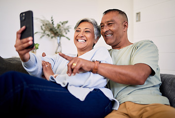 Image showing Love, phone or happy senior couple pointing at social media post, retirement news article or relationship blog story. Cellphone, home and elderly man, old woman or people reading online marriage info