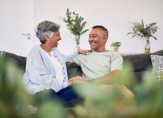 Image showing Love, happy and laughing elderly couple relax, speaking and enjoy funny conversation, care or chat in home apartment. Holding hands, comedy and senior woman, man or people laugh at relationship joke