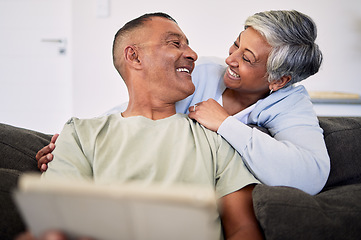 Image showing Love, tablet and happy senior couple bonding, relax and check email, news article and enjoy retirement eye contact. Website story, online shopping and elderly man, old woman or people smile at home