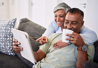 Image showing Home, tablet and happy senior couple on sofa, relax and check email, news article and point at online shopping choice. Website info, decision or elderly man, old woman or people smile in living room