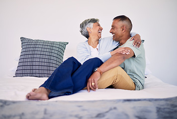 Image showing Hug, bedroom and laughing senior couple bonding, talking and enjoy quality time, funny conversation or trust. Morning discussion, marriage humour and relax elderly people laugh at comedy joke on bed