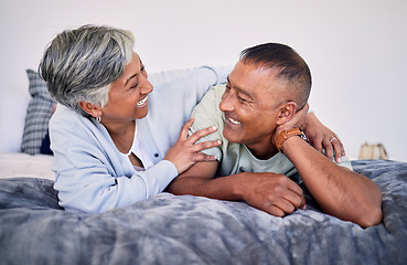 Image showing Love, bedroom and laughing senior couple bonding, happy and enjoy quality time together, funny conversation or comedy. Smile, marriage humour and relax elderly people laugh at retirement joke on bed