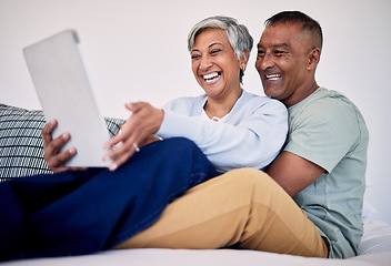 Image showing Bed, tablet and happy elderly couple laughing at funny social network blog, email or watch comedy video, podcast or meme. Funny morning article, home bedroom and senior people laugh, bond and hug