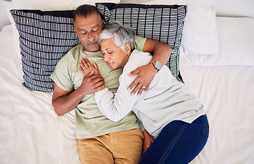 Image showing Top view, bed and senior couple hug, sleeping and marriage with peace, relationship and retirement. Romance, old man and elderly woman in a bedroom, asleep and embrace with happiness, home and care
