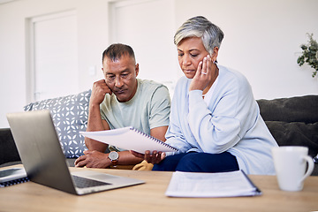 Image showing Senior couple, tax documents and stress with laptop in living room for planning, thinking and budget. Elderly man, woman and paperwork for financial compliance, anxiety or debt in retirement on sofa