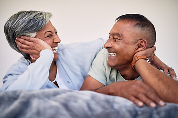 Image showing Love, bedroom face and elderly couple laugh, bond and enjoy quality time together, funny conversation and relax. Home rest, marriage care or senior woman, old man or retirement people laughing in bed