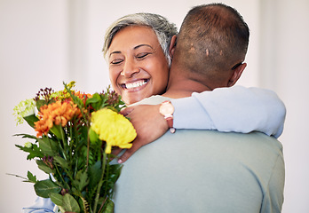 Image showing Flower bouquet, elderly couple hug or gift for happy anniversary, special event or marriage love, care and support. Home bond, sorry and elderly woman, man or excited people smile with floral present