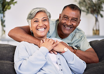 Image showing Portrait, happiness and senior couple on sofa with hug for quality time in living room to relax. Smile, marriage and elder man or woman with embrace on couch with love or care for bonding together.