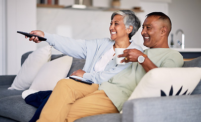 Image showing Senior couple, watching tv and relax on couch in home living room, laugh and together for funny comedy show. Elderly man, old woman and remote control for video, comic movie and lounge sofa in house