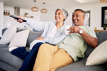 Image showing Senior couple, watching tv and relax on sofa in home living room, laughing and together for funny comedy show. Elderly man, old woman and happy for streaming comic movie on lounge couch in house