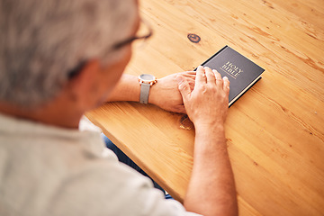 Image showing Bible, hands or above of old man in prayer for support, faith or hope in Christianity in retirement. Worship, praying or senior person studying, reading or learning book of God in spiritual religion