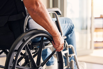 Image showing Man, hands and wheelchair for support, hope or travel in healthcare or medicare at home. Closeup of male or person with a disability moving on chair for mobility, surgery or wellness in the house