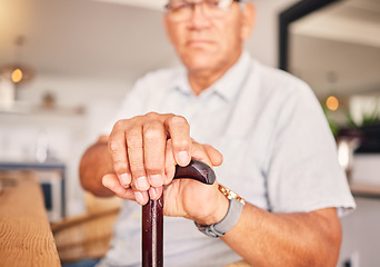 Image showing Hands, serious and portrait of a man with a cane for medical help, senior support and health. Sad, house and an elderly person with a disability in the living room with a walking stick closeup