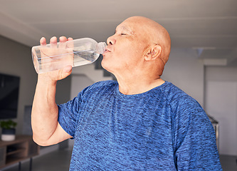 Image showing Home, fitness or senior man drinking water for wellness, hydration or exercise recovery in retirement. Training, fatigue or thirsty mature person drinks healthy h2o liquid on a workout break to relax