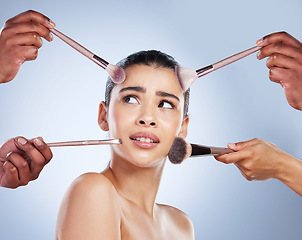 Image showing Brush, makeup and confused face of woman in studio for wellness, beauty and cosmetics on blue background. Cosmetology, skincare and girl with brushes for cosmetic application, foundation and products
