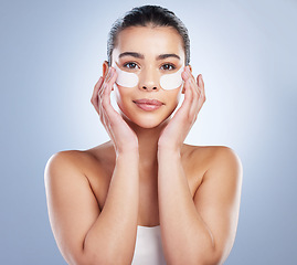 Image showing Skincare, eye mask and portrait of woman in studio for wellness, healthy skin and facial. Dermatology aesthetic, salon and face of female person with patches for moisturizer, cosmetics and beauty