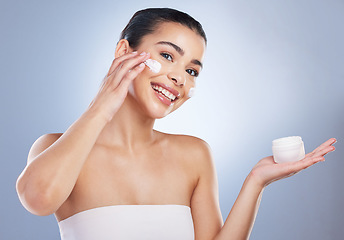 Image showing Skincare, face cream and portrait of woman in studio for natural, health or wellness face routine. Beauty, self care and female model with facial spf, lotion or sunscreen isolated by gray background.