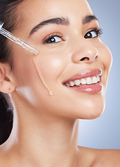 Image showing Skincare, oil serum and portrait of woman in studio for wellness, healthy skin and cosmetics. Dermatology aesthetic, beauty and face of female person with pipette or dropper for facial moisturizer