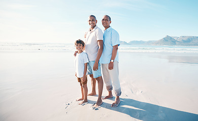 Image showing Happy, portrait and family at the beach with a child for walking, holiday or bonding in summer. Smile, male generation and a father, grandfather and kid at the ocean for travel, vacation or together