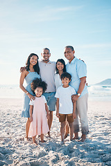 Image showing Beach, happy and portrait of a big family on a vacation, adventure or weekend trip for summer. Smile, bonding and children by the ocean with their parents and grandparents on tropical travel holiday.