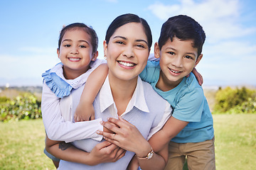 Image showing Happy mother, portrait and hug with kids in nature for quality time, bonding or love together outdoors. Mom, smile and children in piggyback enjoying summer weekend, holiday or vacation in the park