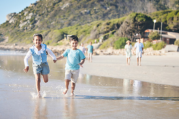 Image showing Kids, brother and sister running at beach, excited and holding hands with smile, adventure and vacation. Young children, happy and playful with race, games and freedom by ocean for summer in Hawaii