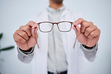 Image showing Hands, person and optometrist with glasses for vision, eyesight and prescription eye care. Closeup of doctor, optician and frame of lens, eyewear test and consulting for optical healthcare assessment